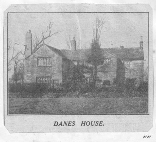 A black and white photo of a house with a large yard

Description automatically generated with low confidence