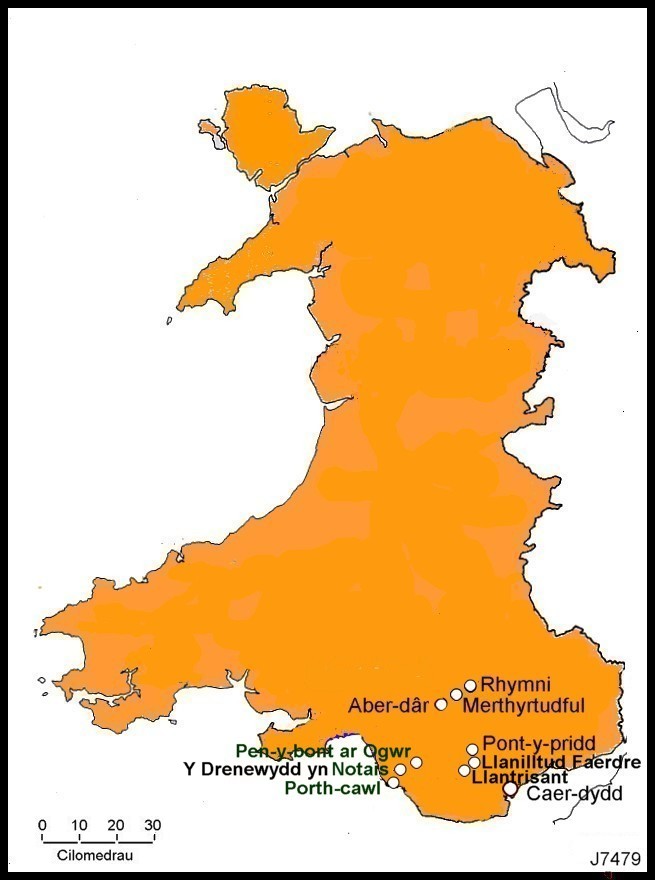 A map of wales with orange and white text

Description automatically generated